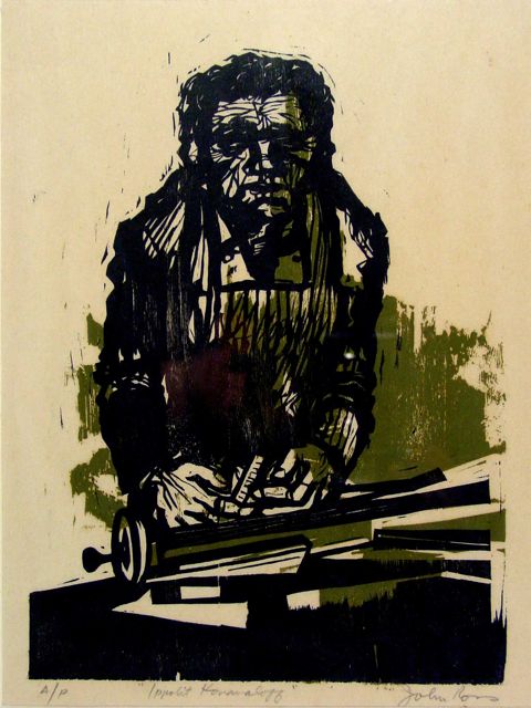 Color photograph of a grassy path cutting through an orchard in full bloom. Rows of trees with pinkish-white blossoms extend into the distance, their branches arching overhead.